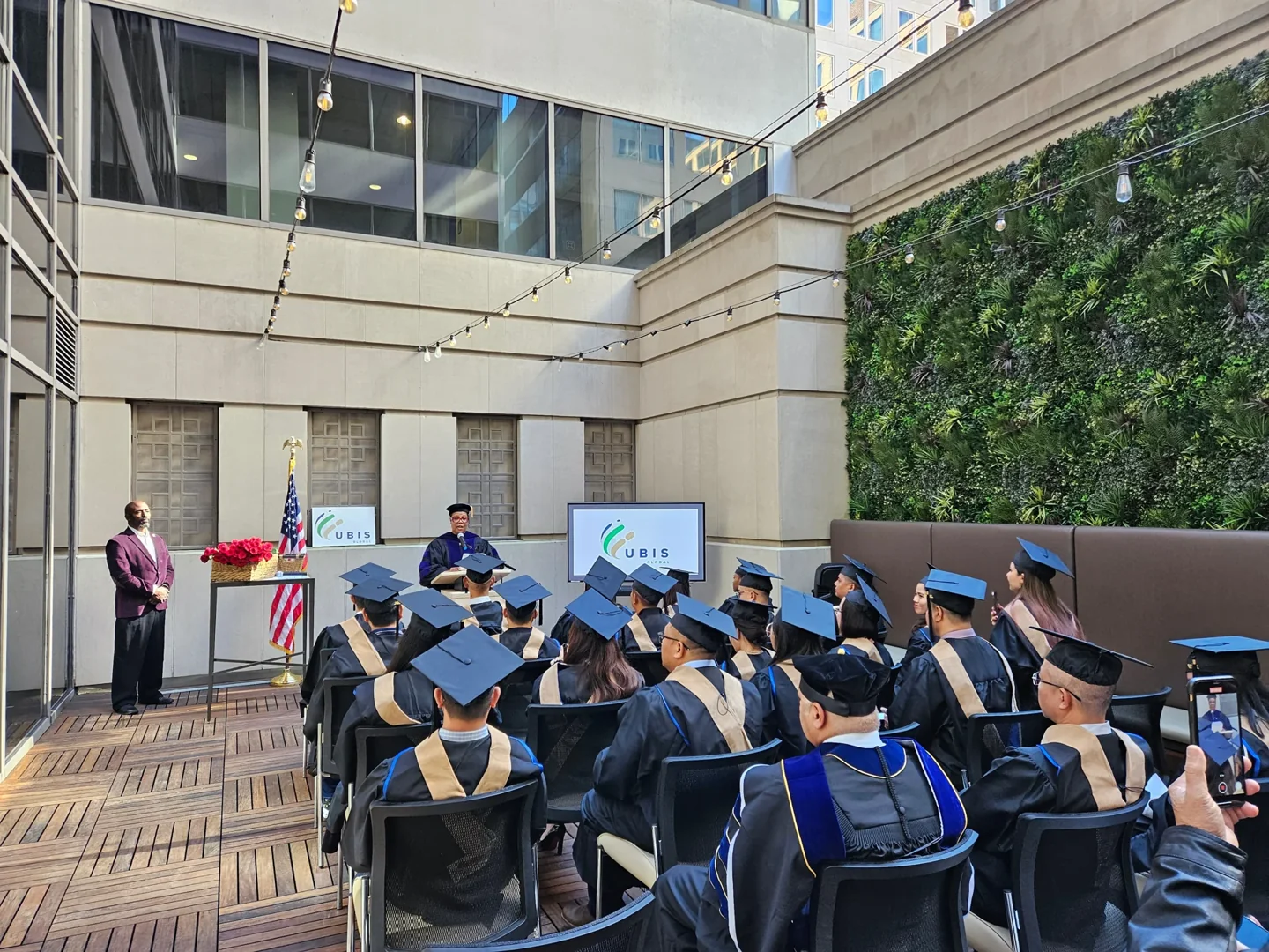 Graduates seated outdoors at a previous UBIS ceremony